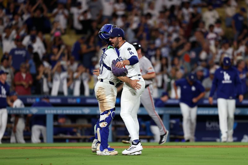 Sep 18, 2025; Los Angeles, California, USA;  Los Angeles Dodgers catcher Ben Rortvedt (47) and relief pitcher Alex Vesia (51) celebrate a win after defeating the San Francisco Giants 2-1 at Dodger Stadium. Mandatory Credit: Kiyoshi Mio-Imagn Images