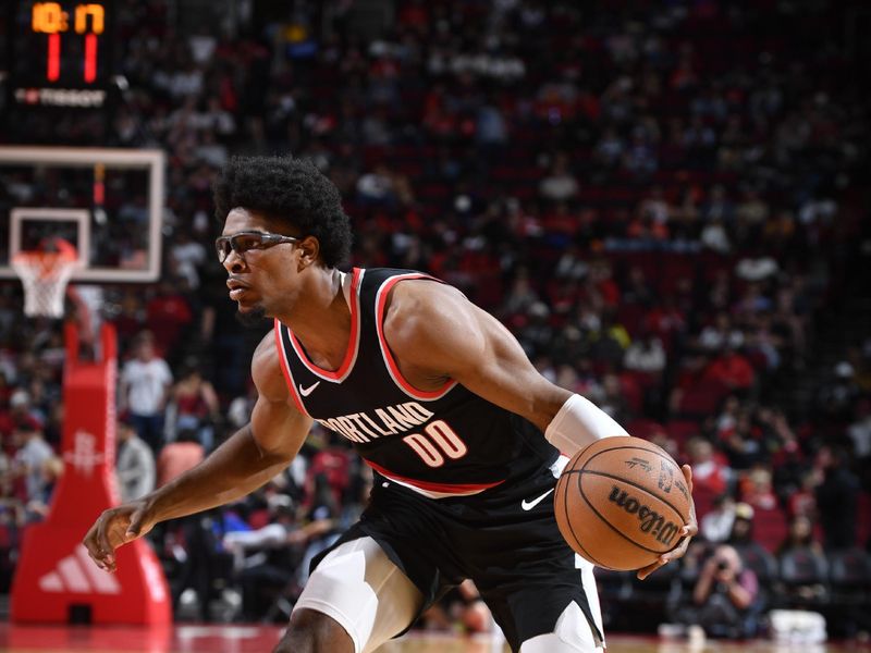 HOUSTON, TX - MARCH 25: Scoot Henderson #00 of the Portland Trail Blazers handles the ball during the game against the Houston Rockets on March 25, 2024 at the Toyota Center in Houston, Texas. NOTE TO USER: User expressly acknowledges and agrees that, by downloading and or using this photograph, User is consenting to the terms and conditions of the Getty Images License Agreement. Mandatory Copyright Notice: Copyright 2024 NBAE (Photo by Logan Riely/NBAE via Getty Images)