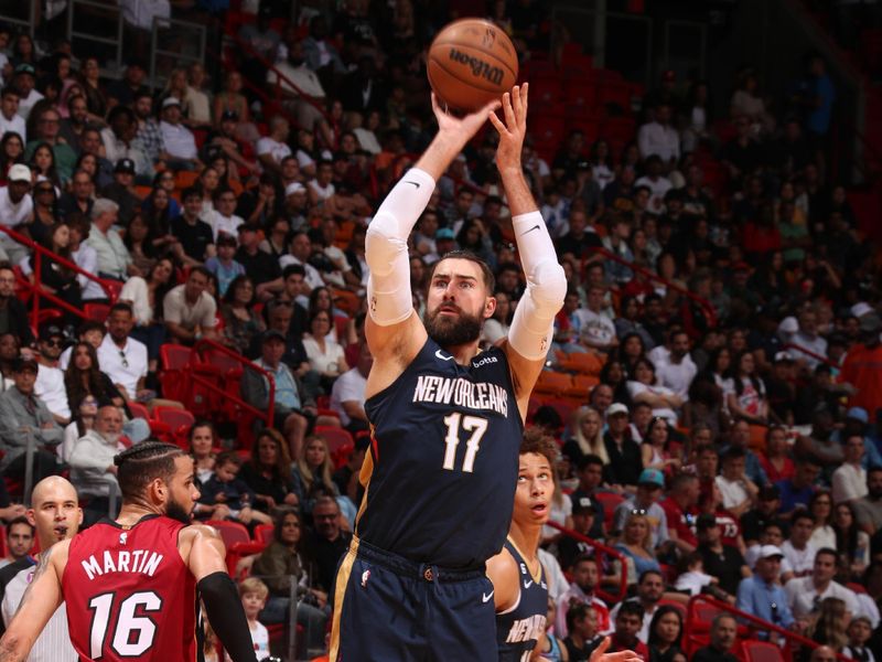 MIAMI, FL - JANUARY 22: Jonas Valanciunas #17 of the New Orleans Pelicans shoots a three point basket during the game against the Miami Heat on January 22, 2023 at Miami-Dade Arena in Miami, Florida. NOTE TO USER: User expressly acknowledges and agrees that, by downloading and or using this Photograph, user is consenting to the terms and conditions of the Getty Images License Agreement. Mandatory Copyright Notice: Copyright 2023 NBAE (Photo by Issac Baldizon/NBAE via Getty Images).