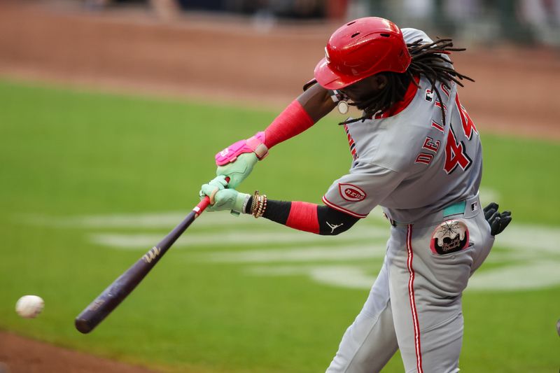 May 7, 2025; Atlanta, Georgia, USA; Cincinnati Reds shortstop Elly De La Cruz (44) hits a single against the Atlanta Braves in the first inning at Truist Park. Mandatory Credit: Brett Davis-Imagn Images