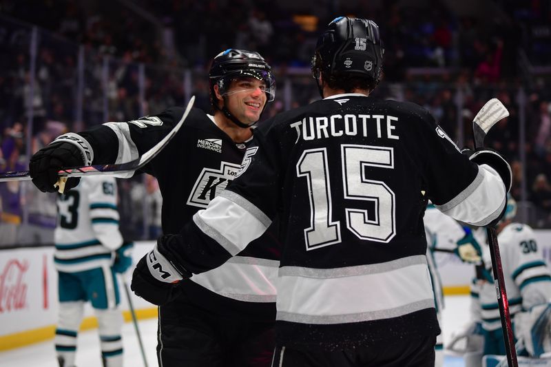 Jan 7, 2026; Los Angeles, California, USA; Los Angeles Kings center Alex Turcotte (15) celebrates his goal scored against the San Jose Sharks with left wing Kevin Fiala (22) during the second period at Crypto.com Arena. Mandatory Credit: Gary A. Vasquez-Imagn Images