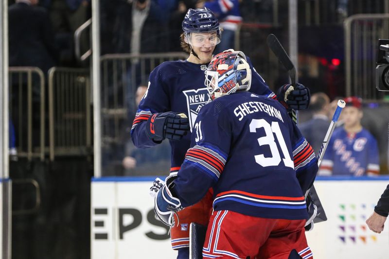 Mar 23, 2024; New York, New York, USA; New York Rangers center Matt Rempe (73) celebrates with New York Rangers goaltender Igor Shesterkin (31) after defeating the Florida Panthers 4-3 in a shootout at Madison Square Garden. Mandatory Credit: Wendell Cruz-USA TODAY Sports