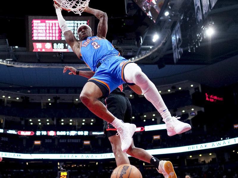 TORONTO, ON - MARCH 16: Shai Gilgeous-Alexander #2 of the Oklahoma City Thunder dunks against the Toronto Raptors during the second half of their basketball game at the Scotiabank Arena on March 16, 2023 in Toronto, Ontario, Canada. NOTE TO USER: User expressly acknowledges and agrees that, by downloading and/or using this Photograph, user is consenting to the terms and conditions of the Getty Images License Agreement. (Photo by Mark Blinch/Getty Images)