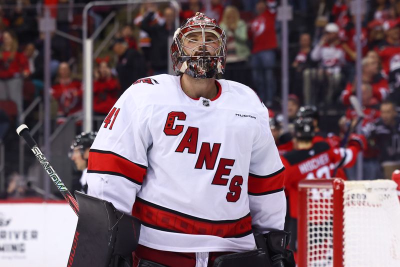 Nov 21, 2024; Newark, New Jersey, USA; Carolina Hurricanes goaltender Spencer Martin (41) reacts after giving up a goal against the New Jersey Devils during the second period at Prudential Center. Mandatory Credit: Ed Mulholland-Imagn Images