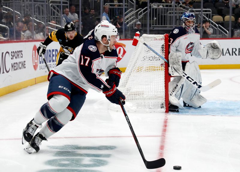 Mar 5, 2024; Pittsburgh, Pennsylvania, USA; Columbus Blue Jackets right wing Justin Danforth (17) moves the puck against the Pittsburgh Penguins during the first period at PPG Paints Arena. Mandatory Credit: Charles LeClaire-USA TODAY Sports