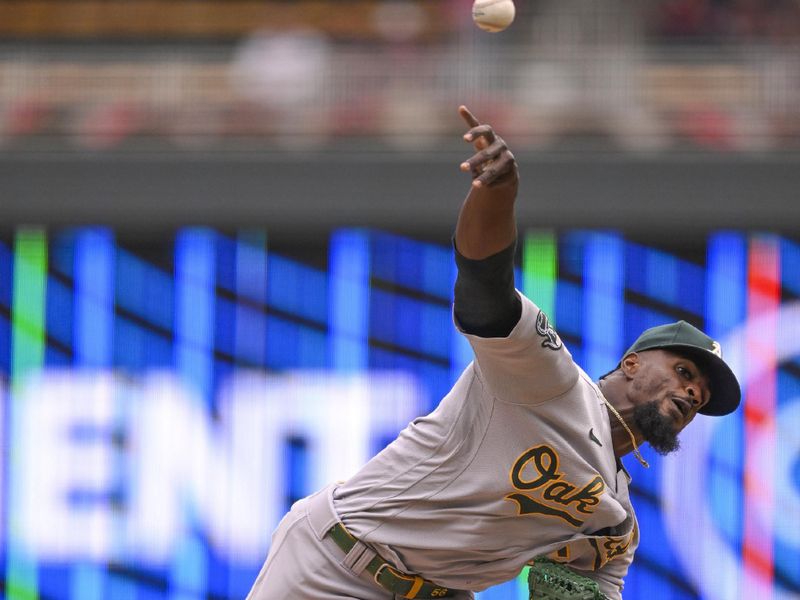 Sep 28, 2023; Minneapolis, Minnesota, USA; Oakland Athletics pitcher Dany Jimenez (56) delivers a pitch against the Minnesota Twins during the eighth inning at Target Field. Mandatory Credit: Nick Wosika-USA TODAY Sports