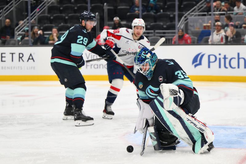 Jan 23, 2025; Seattle, Washington, USA; Seattle Kraken goaltender Joey Daccord (35) blocks a goal shot during the second period against the Washington Capitals at Climate Pledge Arena. Mandatory Credit: Steven Bisig-Imagn Images