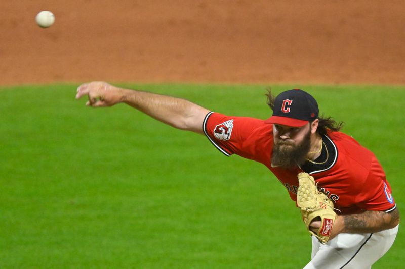 May 12, 2025; Cleveland, Ohio, USA; Cleveland Guardians relief pitcher Hunter Gaddis (33) delivers a pitch in the ninth inning against the Milwaukee Brewers at Progressive Field. Mandatory Credit: David Richard-Imagn Images