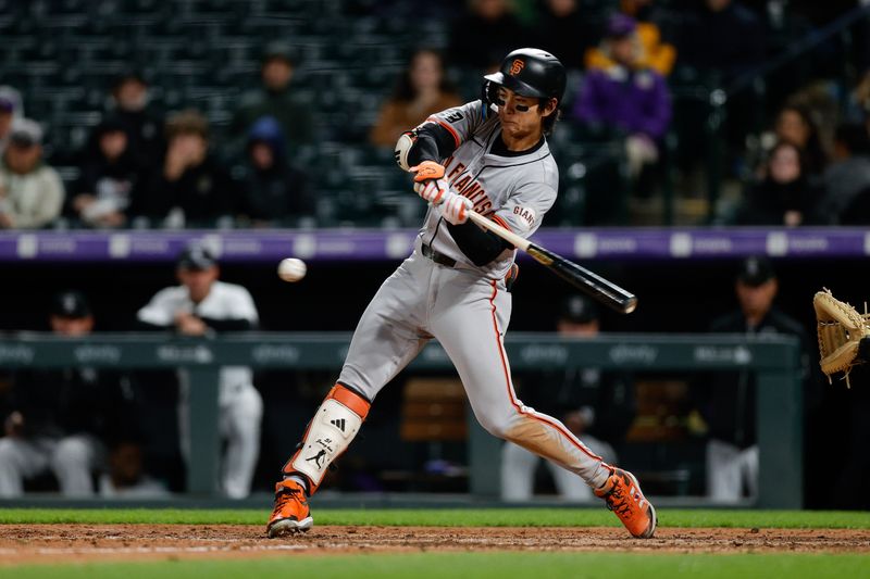 May 7, 2024; Denver, Colorado, USA; San Francisco Giants center fielder Jung Hoo Lee (51) hits a single in the eighth inning against the Colorado Rockies at Coors Field. Mandatory Credit: Isaiah J. Downing-USA TODAY Sports