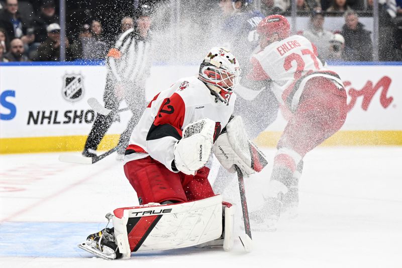 Mar 20, 2026; Toronto, Ontario, CAN;  Carolina Hurricanes goalie Brandon Bussi (32) defends his goal against the Toronto Maple Leafs in the first period at Scotiabank Arena. Mandatory Credit: Dan Hamilton-Imagn Images