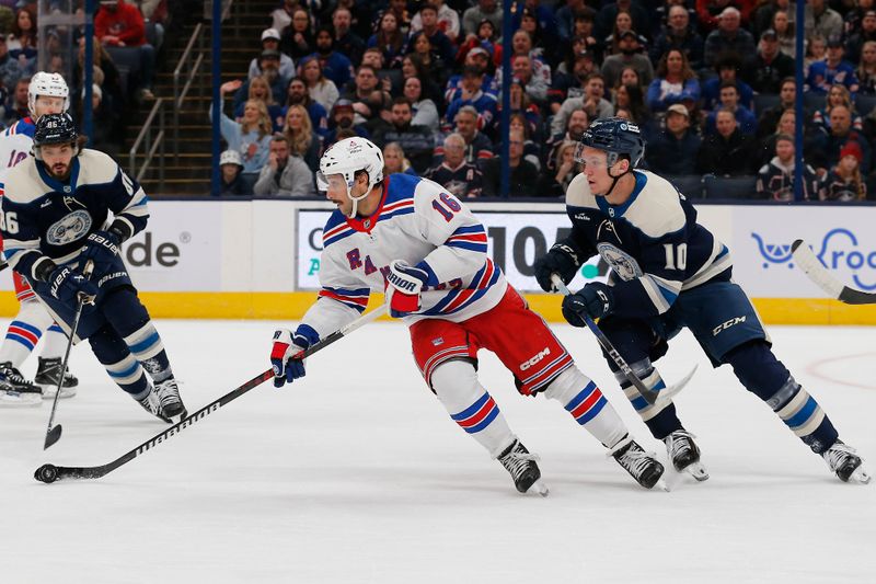 Feb 25, 2024; Columbus, Ohio, USA; New York Rangers center Vincent Trocheck (16) carries the puck as Columbus Blue Jackets left wing Dmitri Voronkov (10) trails the play during the first period at Nationwide Arena. Mandatory Credit: Russell LaBounty-USA TODAY Sports