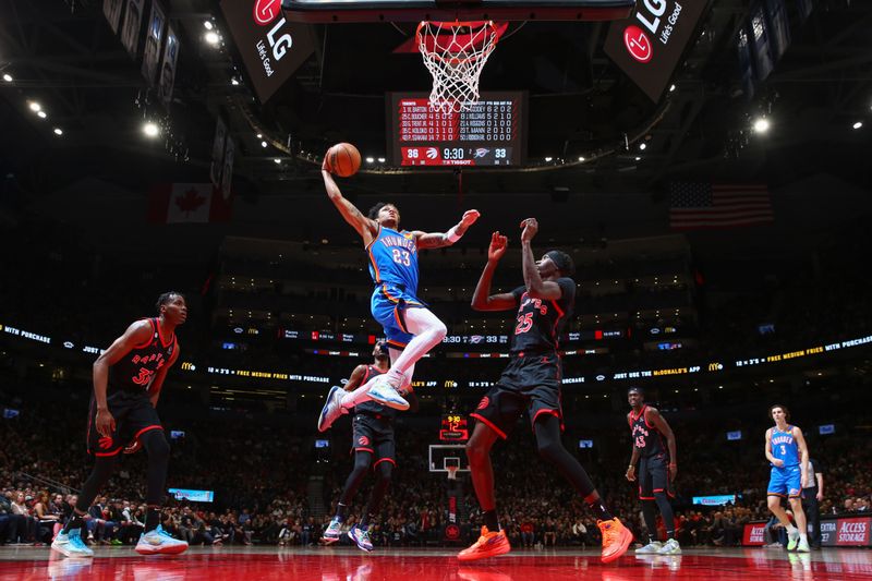 TORONTO, CANADA - MARCH 16:  Tre Mann #23 of the Oklahoma City Thunder goes to the basket during the game on March 16, 2023 at the Scotiabank Arena in Toronto, Ontario, Canada.  NOTE TO USER: User expressly acknowledges and agrees that, by downloading and or using this Photograph, user is consenting to the terms and conditions of the Getty Images License Agreement.  Mandatory Copyright Notice: Copyright 2023 NBAE (Photo by Vaughn Ridley/NBAE via Getty Images)