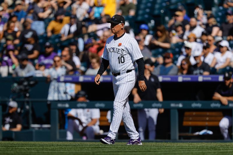 May 27, 2024; Denver, Colorado, USA; Colorado Rockies manager Bud Black (10) walks to the mound to make a pitching change in the seventh inning against the Cleveland Guardians at Coors Field. Mandatory Credit: Isaiah J. Downing-USA TODAY Sports