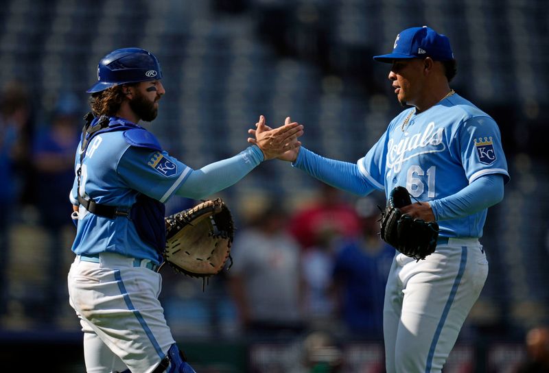 Sep 20, 2023; Kansas City, Missouri, USA; Kansas City Royals catcher Logan Porter (88) celebrates with relief pitcher Angel Zerpa (61) after defeating the Cleveland Guardians at Kauffman Stadium. Mandatory Credit: Jay Biggerstaff-USA TODAY Sports