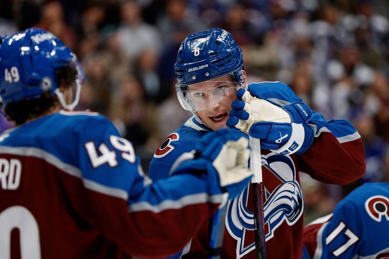 Oct 30, 2024; Denver, Colorado, USA; Colorado Avalanche defenseman Cale Makar (8) talks with defenseman Samuel Girard (49) in the first period against the Tampa Bay Lightning at Ball Arena. Mandatory Credit: Isaiah J. Downing-Imagn Images