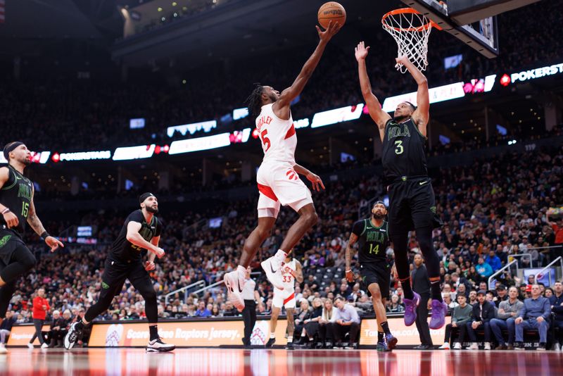 TORONTO, CANADA - MARCH 5: Immanuel Quickley #5 of the Toronto Raptors drives to the net against CJ McCollum #3 of the New Orleans Pelicans during the first half of their NBA game at Scotiabank Arena on March 5, 2024 in Toronto, Canada. NOTE TO USER: User expressly acknowledges and agrees that, by downloading and or using this photograph, User is consenting to the terms and conditions of the Getty Images License Agreement. (Photo by Cole Burston/Getty Images)