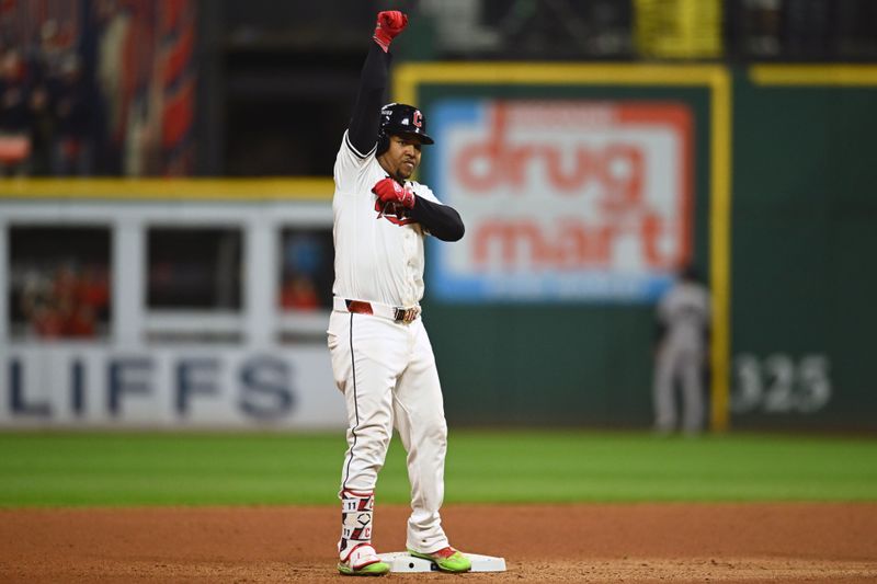 Oct 18, 2024; Cleveland, Ohio, USA; Cleveland Guardians third baseman Jose Ramirez (11) celebrate at second base after hitting an RBI double in the seventh inning against the New York Yankees during game four of the ALCS for the 2024 MLB playoffs at Progressive Field. Mandatory Credit: Ken Blaze-Imagn Images