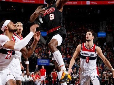 PORTLAND, OR - DECEMBER 21: Jerami Grant #9 of the Portland Trail Blazers drives to the basket during the game against the Washington Wizards on December 21, 2023 at the Moda Center Arena in Portland, Oregon. NOTE TO USER: User expressly acknowledges and agrees that, by downloading and or using this photograph, user is consenting to the terms and conditions of the Getty Images License Agreement. Mandatory Copyright Notice: Copyright 2023 NBAE (Photo by Cameron Browne/NBAE via Getty Images)