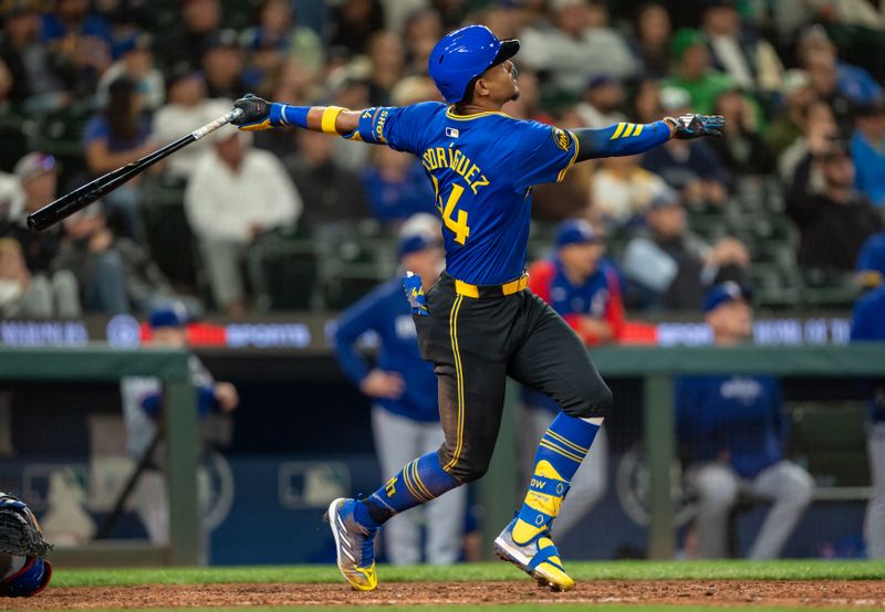 Sep 13, 2024; Seattle, Washington, USA;  Seattle Mariners centerfielder Julio Rodriguez (44) hits a three-run home run during the eighth inning against the Texas Rangers at T-Mobile Park. Mandatory Credit: Stephen Brashear-Imagn Images