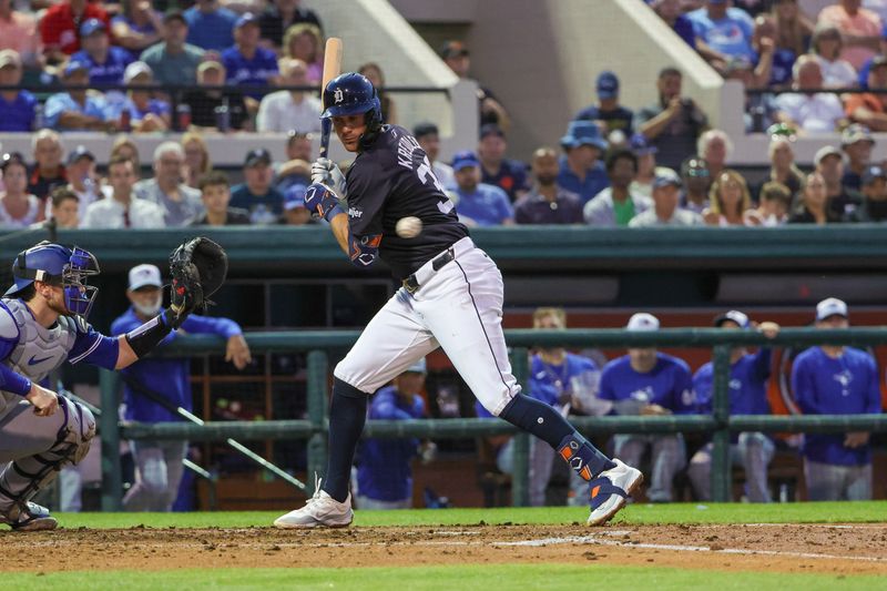 Mar 7, 2024; Lakeland, Florida, USA; Detroit Tigers shortstop Ryan Kreidler (32) dodges an inside pitch during the second inning against the Toronto Blue Jays at Publix Field at Joker Marchant Stadium. Mandatory Credit: Mike Watters-USA TODAY Sports