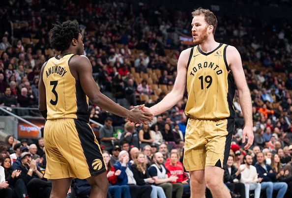 TORONTO, ON - NOVEMBER 24: Jakob Poeltl #19 of Toronto Raptors slaps hands with OG Anunoby #3 against the Chicago Bulls during the first half of their NBA In-Season Tournament game at the Scotiabank Arena on November 24, 2023 in Toronto, Ontario, Canada. NOTE TO USER: User expressly acknowledges and agrees that, by downloading and/or using this Photograph, user is consenting to the terms and conditions of the Getty Images License Agreement. (Photo by Mark Blinch/Getty Images)