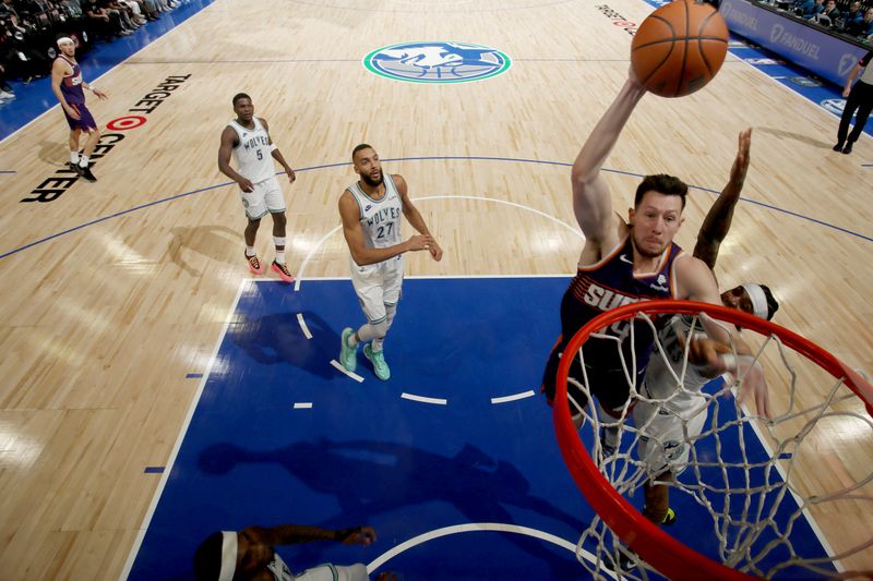 MINNEAPOLIS, MN -  APRIL 23: Drew Eubanks #14 of the Phoenix Suns dunks the ball during the game against the Minnesota Timberwolves during Round One Game Two of the 2024 NBA Playoffs on April 23, 2024 at Target Center in Minneapolis, Minnesota. NOTE TO USER: User expressly acknowledges and agrees that, by downloading and or using this Photograph, user is consenting to the terms and conditions of the Getty Images License Agreement. Mandatory Copyright Notice: Copyright 2024 NBAE (Photo by Jordan Johnson/NBAE via Getty Images)