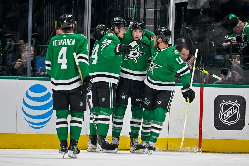 Apr 9, 2024; Dallas, Texas, USA; Dallas Stars defenseman Miro Heiskanen (4) and center Roope Hintz (24) and left wing Jason Robertson (21) and center Joe Pavelski (16) celebrates a goal scored by Robertson against the Buffalo Sabres during the first period at the American Airlines Center. Mandatory Credit: Jerome Miron-USA TODAY Sports