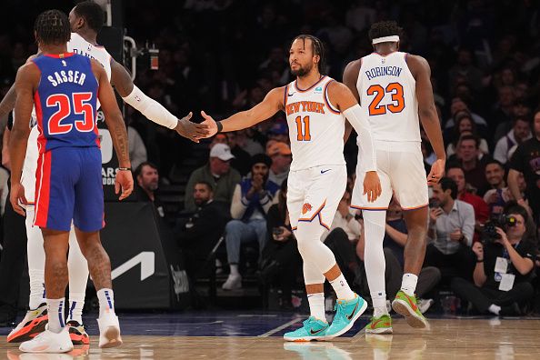 NEW YORK, NY - NOVEMBER 30: Jalen Brunson #11 of the New York Knicks high fives during the game against the Detroit Pistons on November 30, 2023 at Madison Square Garden in New York City, New York.  NOTE TO USER: User expressly acknowledges and agrees that, by downloading and or using this photograph, User is consenting to the terms and conditions of the Getty Images License Agreement. Mandatory Copyright Notice: Copyright 2023 NBAE  (Photo by Jesse D. Garrabrant/NBAE via Getty Images)