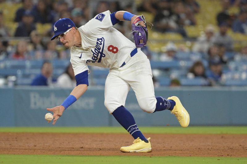 Jul 24, 2024; Los Angeles, California, USA;  Los Angeles Dodgers third baseman Enrique Hernandez (8) makes a play to throw out San Francisco Giants center fielder Tyler Fitzgerald (49) at first in the eighth inning at Dodger Stadium. Mandatory Credit: Jayne Kamin-Oncea-USA TODAY Sports