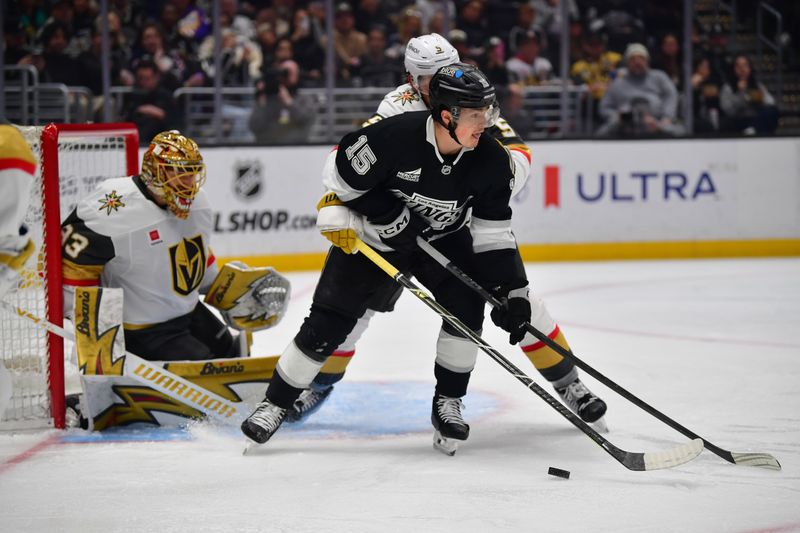 Feb 25, 2026; Los Angeles, California, USA; Los Angeles Kings center Alex Turcotte (15) plays the puck in front of Vegas Golden Knights goaltender Adin Hill (33) during the second period at Crypto.com Arena. Mandatory Credit: Gary A. Vasquez-Imagn Images