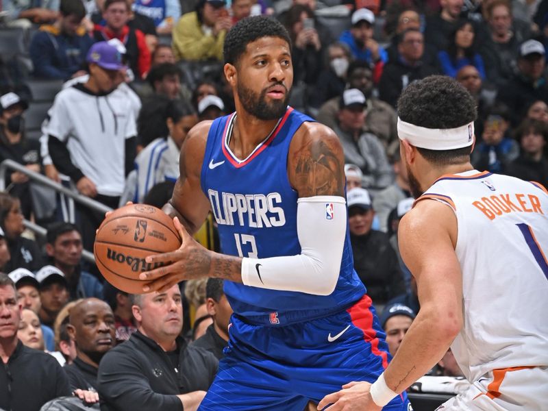 LOS ANGELES, CA - JANUARY 8: Paul George #13 of the LA Clippers looks to pass the ball during the game against the Phoenix Suns on January 8, 2024 at Crypto.Com Arena in Los Angeles, California. NOTE TO USER: User expressly acknowledges and agrees that, by downloading and/or using this Photograph, user is consenting to the terms and conditions of the Getty Images License Agreement. Mandatory Copyright Notice: Copyright 2024 NBAE (Photo by Andrew D. Bernstein/NBAE via Getty Images)