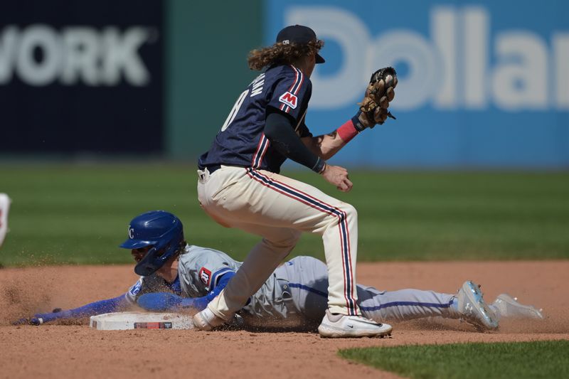 Jun 6, 2024; Cleveland, Ohio, USA; Kansas City Royals shortstop Bobby Witt Jr. (7) steals second as Cleveland Guardians shortstop Daniel Schneemann (10) is late with the tag during the ninth inning at Progressive Field. Mandatory Credit: Ken Blaze-USA TODAY Sports