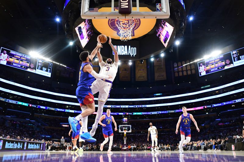 LOS ANGELES, CA - MARCH 2:  Anthony Davis #3 of the Los Angeles Lakers drives to the basket during the game against the Denver Nuggets on March 2, 2024 at Crypto.Com Arena in Los Angeles, California. NOTE TO USER: User expressly acknowledges and agrees that, by downloading and/or using this Photograph, user is consenting to the terms and conditions of the Getty Images License Agreement. Mandatory Copyright Notice: Copyright 2024 NBAE (Photo by Adam Pantozzi/NBAE via Getty Images)