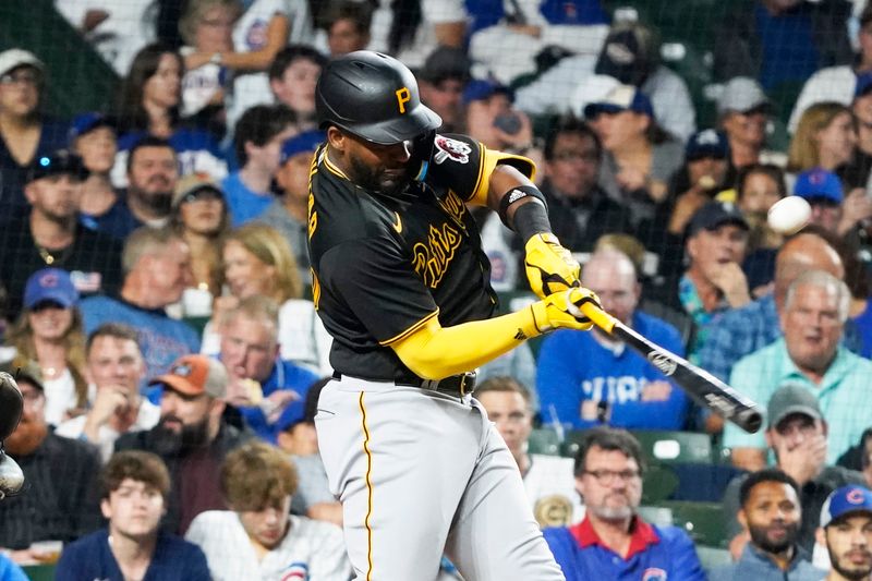 Sep 21, 2023; Chicago, Illinois, USA; Pittsburgh Pirates right fielder Miguel Andujar (26) hits a one run single against the Chicago Cubs during the fifth inning at Wrigley Field. Mandatory Credit: David Banks-USA TODAY Sports