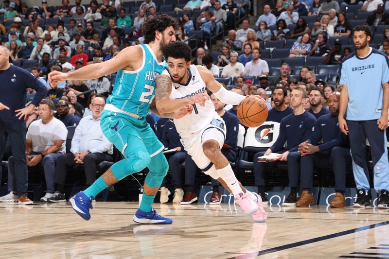 MEMPHIS, TN - OCTOBER 10: Scotty Pippen Jr. #1 of the Memphis Grizzlies drives to the basket during the game against the Charlotte Hornets during a NBA Preseason game on October 10, 2024 at FedExForum in Memphis, Tennessee. NOTE TO USER: User expressly acknowledges and agrees that, by downloading and or using this photograph, User is consenting to the terms and conditions of the Getty Images License Agreement. Mandatory Copyright Notice: Copyright 2024 NBAE (Photo by Joe Murphy/NBAE via Getty Images)