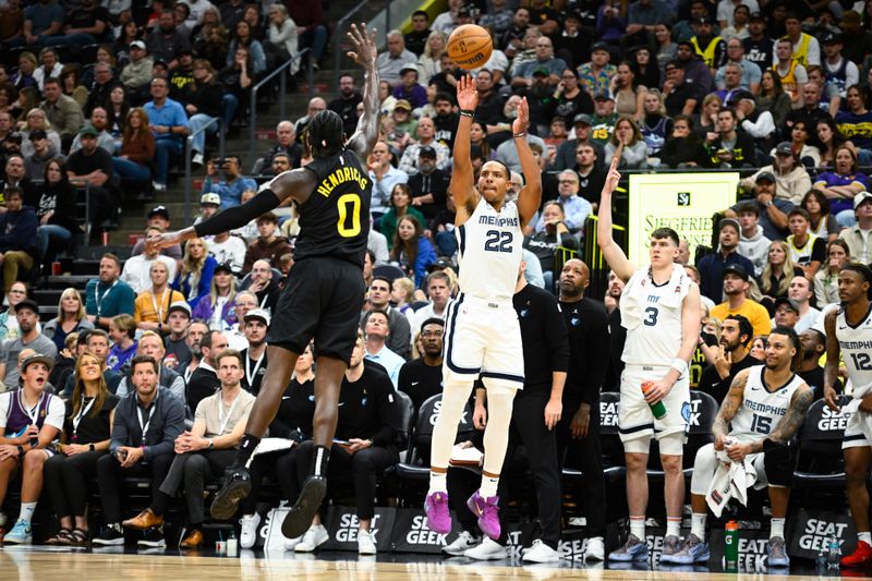 SALT LAKE CITY, UTAH - OCTOBER 23: Desmond Bane #22 of the Memphis Grizzlies shoots the ball over Taylor Hendricks #0 of the Utah Jazz during the fourth quarter at Delta Center on October 23, 2024 in Salt Lake City, Utah. NOTE TO USER: User expressly acknowledges and agrees that, by downloading and or using this photograph, User is consenting to the terms and conditions of the Getty Images License Agreement. (Photo by Alex Goodlett/Getty Images)