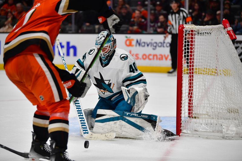 Apr 1, 2025; Anaheim, California, USA; San Jose Sharks goaltender Alexandar Georgiev (40) defends the goal against Anaheim Ducks right wing Frank Vatrano (77) during the overtime period at Honda Center. Mandatory Credit: Gary A. Vasquez-Imagn Images