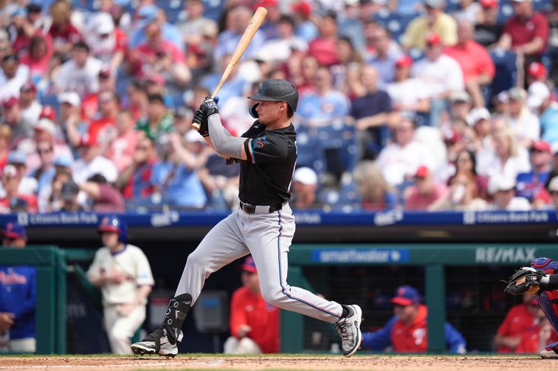 Apr 19, 2025; Philadelphia, Pennsylvania, USA; Miami Marlins outfielder Griffin Conine (18) hits an RBI double against the Philadelphia Phillies in the sixth inning at Citizens Bank Park. Mandatory Credit: Kyle Ross-Imagn Images