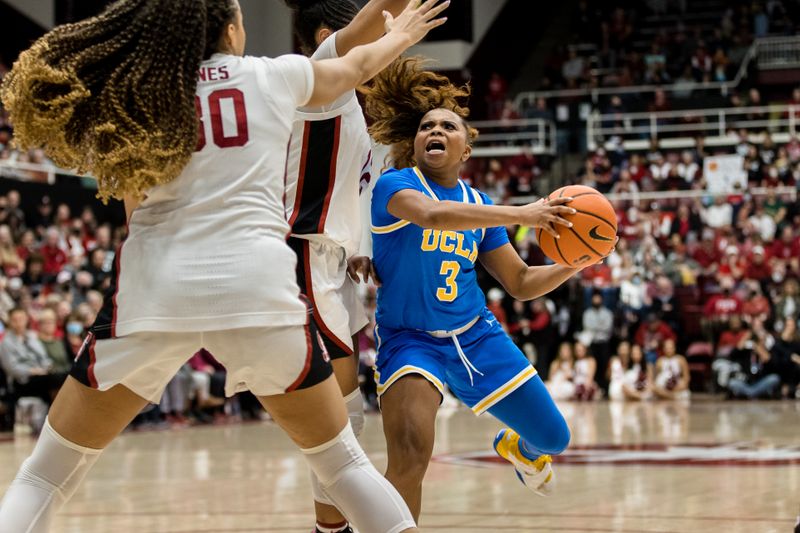 Feb 20, 2023; Stanford, California, USA;  UCLA Bruins guard Londynn Jones (3) moves to the basket as Stanford Cardinal guard Haley Jones (30) and others defend during the second half at Maples Pavilion. Mandatory Credit: John Hefti-USA TODAY Sports