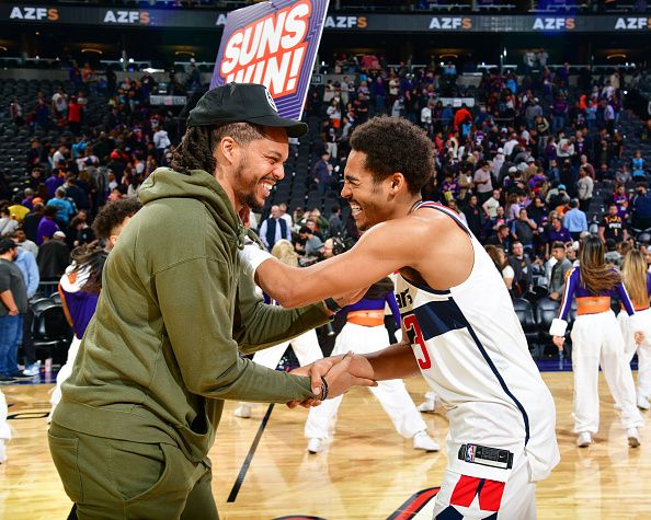 PHOENIX, AZ - DECEMBER 17: Damion Lee #10 of the Phoenix Suns & Jordan Poole #13 of the Washington Wizards embrace after the game on December 17, 2022 at Footprint Center in Phoenix, Arizona. NOTE TO USER: User expressly acknowledges and agrees that, by downloading and or using this photograph, user is consenting to the terms and conditions of the Getty Images License Agreement. Mandatory Copyright Notice: Copyright 2022 NBAE (Photo by Kate Frese/NBAE via Getty Images)