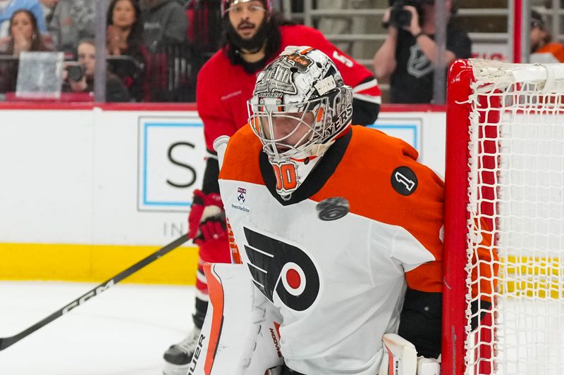 Dec 14, 2025; Raleigh, North Carolina, USA;  Philadelphia Flyers goaltender Dan Vladar (80) stops the shot against the Carolina Hurricanes during the first period at Lenovo Center. Mandatory Credit: James Guillory-Imagn Images