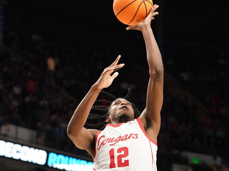 Mar 18, 2023; Birmingham, AL, USA; Houston Cougars guard Tramon Mark (12) shoots during the second half against the Auburn Tigers at Legacy Arena. Mandatory Credit: Marvin Gentry-USA TODAY Sports