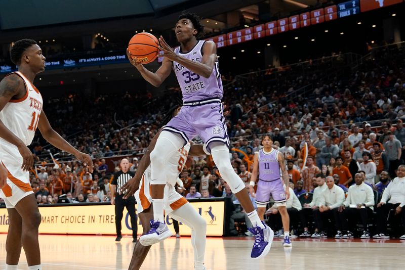 Jan 3, 2023; Austin, Texas, USA; Kansas State Wildcats forward Nae'Qwan Tomlin (35) drives to the basket against Texas Longhorns 10 guard Sir'Jabari Rice (10) during the second half at Moody Center. Mandatory Credit: Scott Wachter-USA TODAY Sports