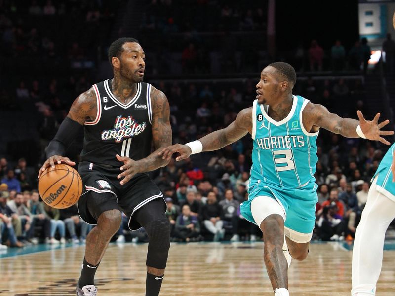 CHARLOTTE, NC - DECEMBER 5: John Wall #11 of the LA Clippers drives to the basket against the Charlotte Hornets on December 5, 2022 at Spectrum Center in Charlotte, North Carolina. NOTE TO USER: User expressly acknowledges and agrees that, by downloading and or using this photograph, User is consenting to the terms and conditions of the Getty Images License Agreement.  Mandatory Copyright Notice:  Copyright 2022 NBAE (Photo by Brock Williams-Smith/NBAE via Getty Images)