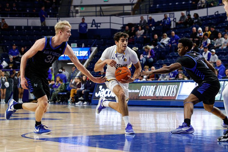 Jan 13, 2024; Colorado Springs, Colorado, USA; San Jose State Spartans guard Alvaro Cardenas (13) controls the ball against Air Force Falcons forward Rytis Petraitis (31) and guard Byron Brown (11) in the first half at Clune Arena. Mandatory Credit: Isaiah J. Downing-USA TODAY Sports