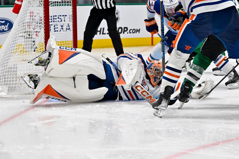 May 23, 2024; Dallas, Texas, USA; Edmonton Oilers goaltender Stuart Skinner (74) makes a save on a shot by Dallas Stars left wing Jamie Benn (14) during the overtime period in game one of the Western Conference Final of the 2024 Stanley Cup Playoffs at American Airlines Center. Mandatory Credit: Jerome Miron-USA TODAY Sports