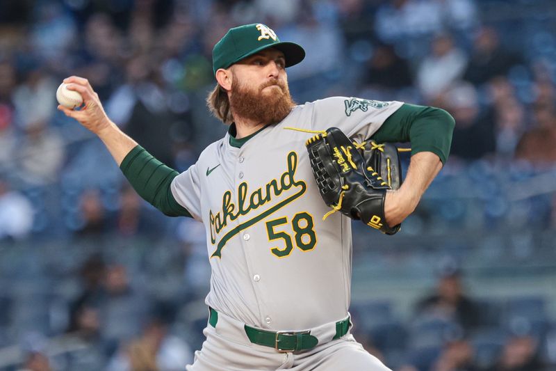 Apr 23, 2024; Bronx, New York, USA; Oakland Athletics pitcher Paul Blackburn (58) delivers a pitch during the first inning against the New York Yankees at Yankee Stadium. Mandatory Credit: Vincent Carchietta-USA TODAY Sports