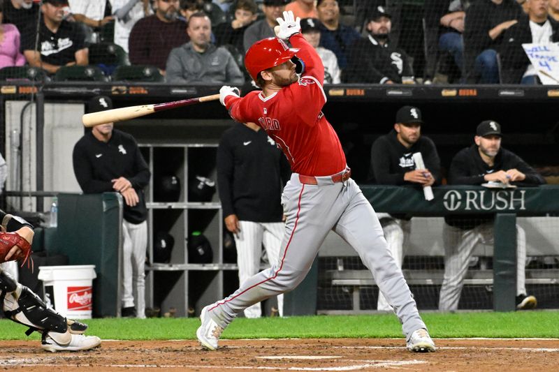 Sep 25, 2024; Chicago, Illinois, USA;  Los Angeles Angels outfielder Taylor Ward (3) hits a two RBI single against the Chicago White Sox during the fourth inning at Guaranteed Rate Field. Mandatory Credit: Matt Marton-Imagn Images