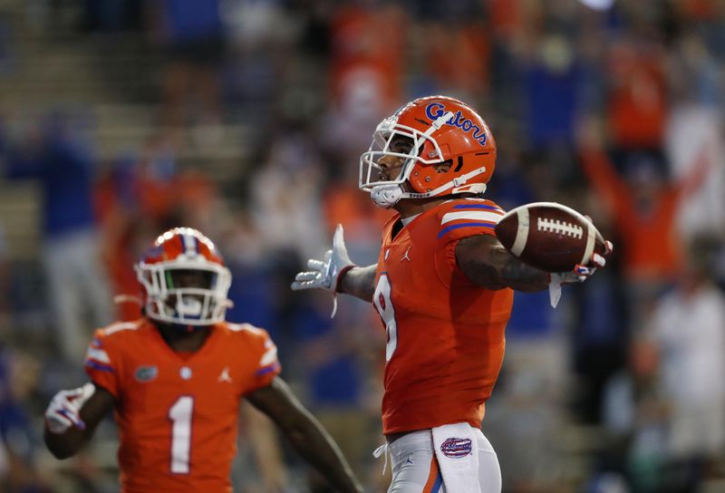 Nov 14, 2020; Gainesville, FL, USA;  Florida Gators wide receiver Trevon Grimes (8) scores a touchdown against the Arkansas Razorbacks at Ben Hill Griffin Stadium. Mandatory Credit: Courtney Culbreath/Handout Photo via USA TODAY Sports