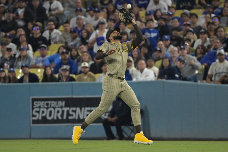 Sep 26, 2024; Los Angeles, California, USA;  Los Angeles Dodgers catcher Will Smith (16) flies out to San Diego Padres right fielder Fernando Tatis Jr. (23) in the second inning at Dodger Stadium. Mandatory Credit: Jayne Kamin-Oncea-Imagn Images